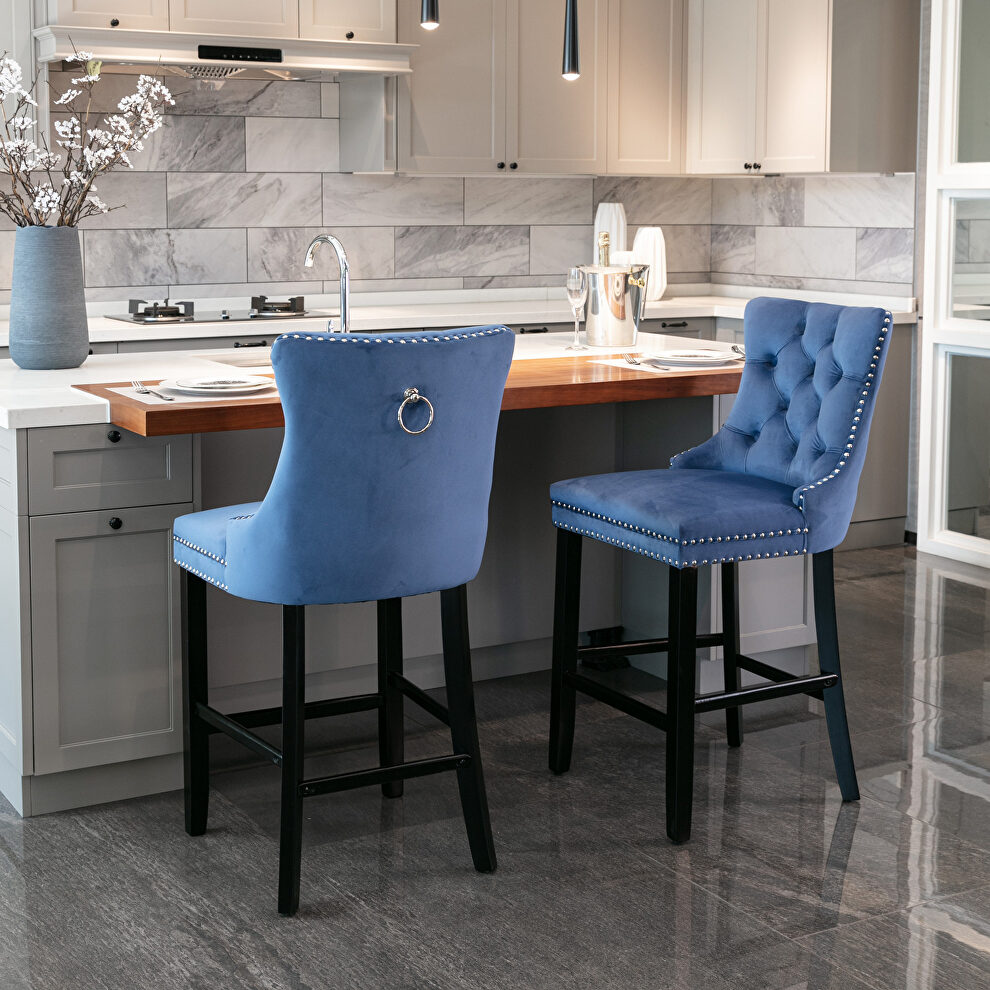 Blue velvet upholstered barstools with button tufted decoration and chrome nailhead by La Spezia