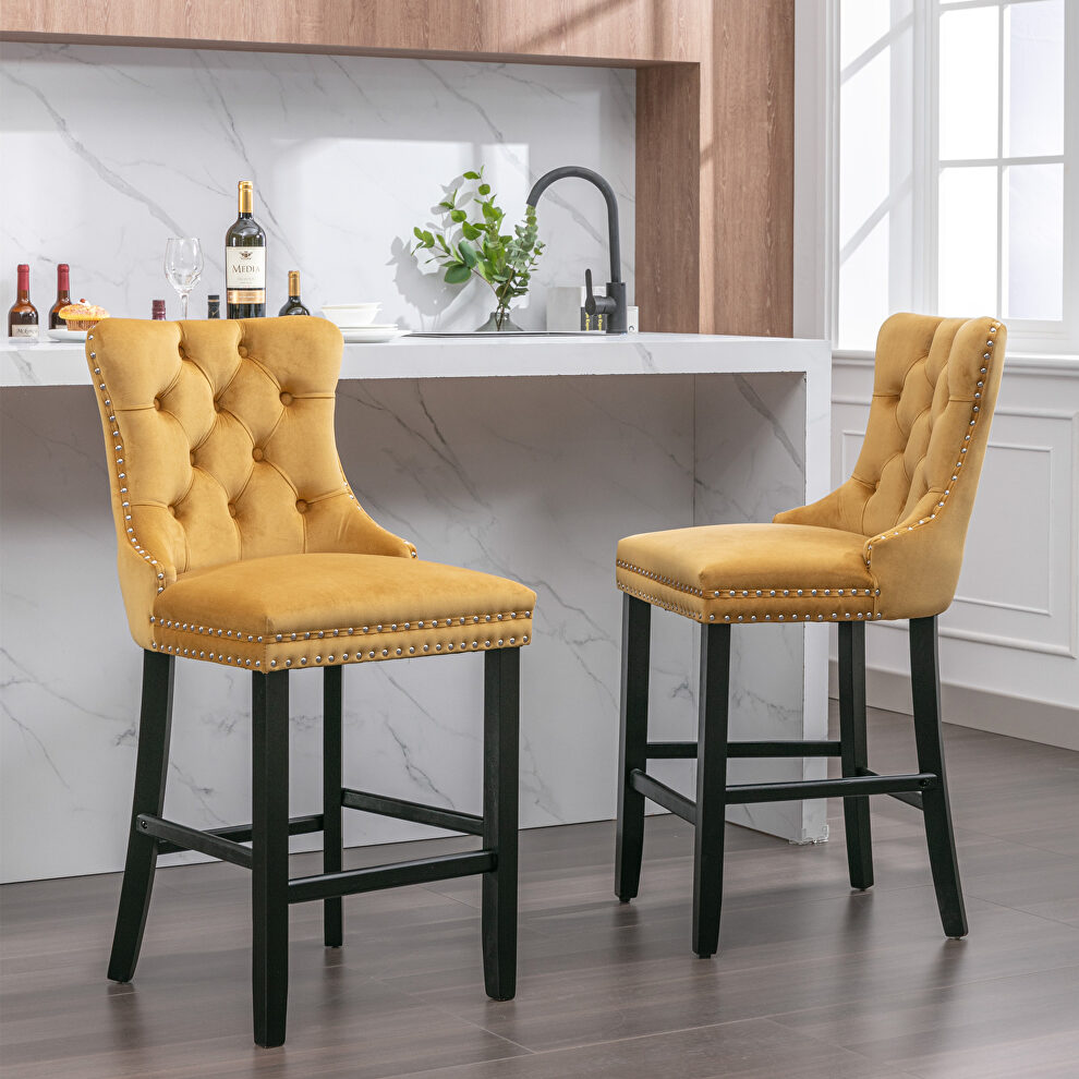 Gold velvet upholstered barstools with button tufted decoration and chrome nailhead by La Spezia
