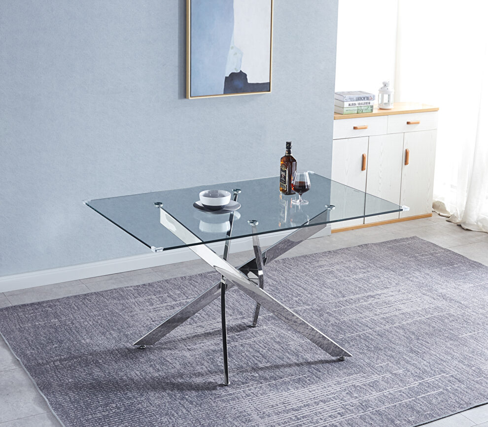 Tempered glass top modern dining table with chrome stainless steel base in silver by La Spezia