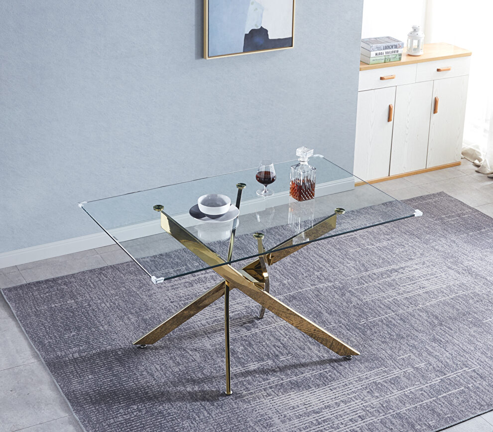 Tempered glass top modern dining table with chrome stainless steel base in gold by La Spezia