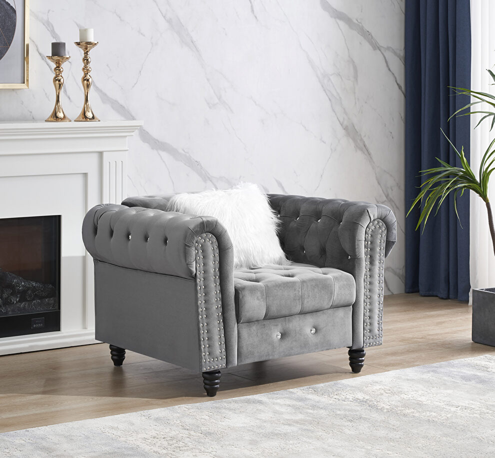 Gray velvet chesterfield classic chair with pillow in white by La Spezia