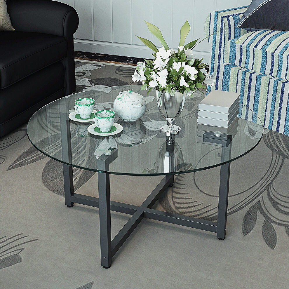 Round transparent tempered glass top and black legs coffee table by La Spezia
