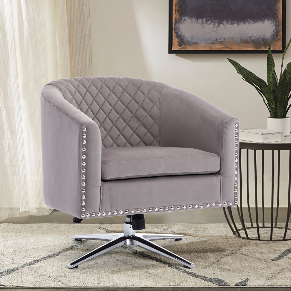 Gray velvet swivel barrel chair with nailheads and metal base by La Spezia