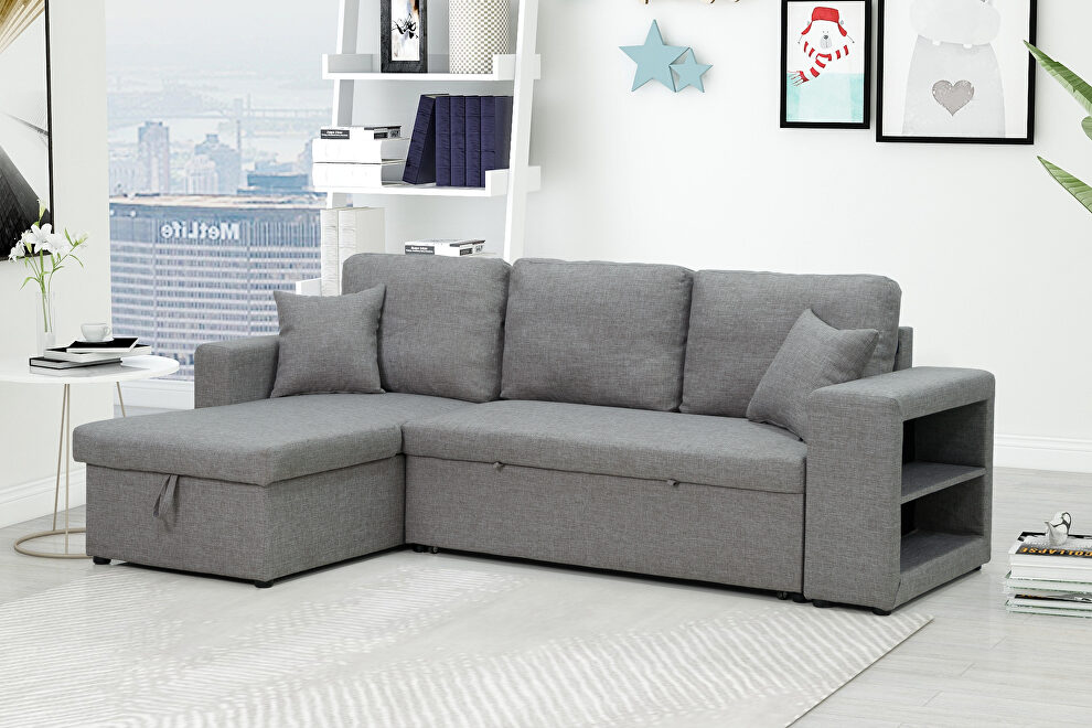 Gray sectional sofa with pulled out bed, 2 seats sofa and reversible chaise with storage by La Spezia