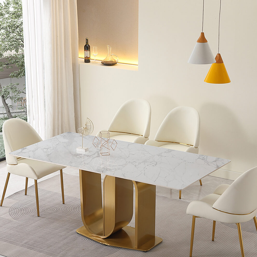 Contemporary dining table in gold with sintered stone top and u-shape pedestal base by La Spezia