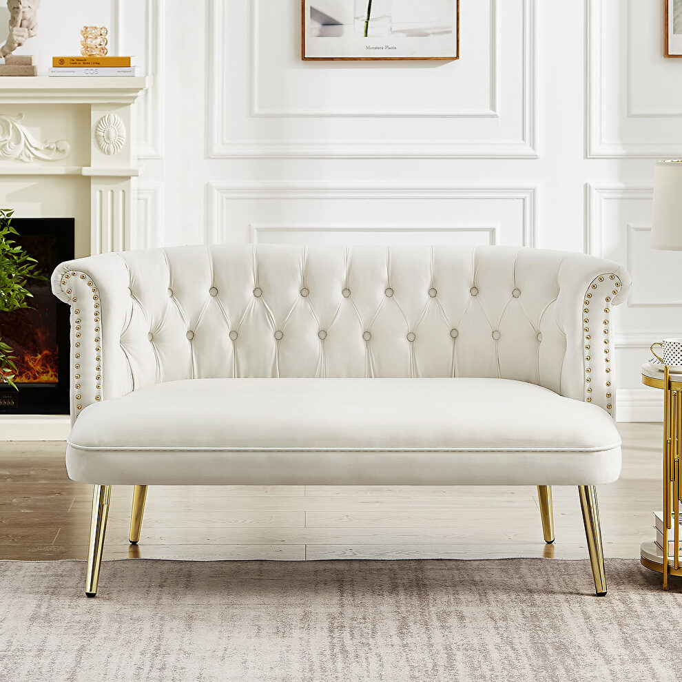 Cream white velvet sofa with nailhead arms with gold metal legs by La Spezia