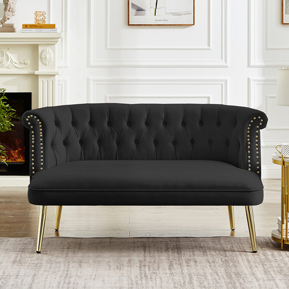 Black velvet sofa with nailhead arms with gold metal legs by La Spezia