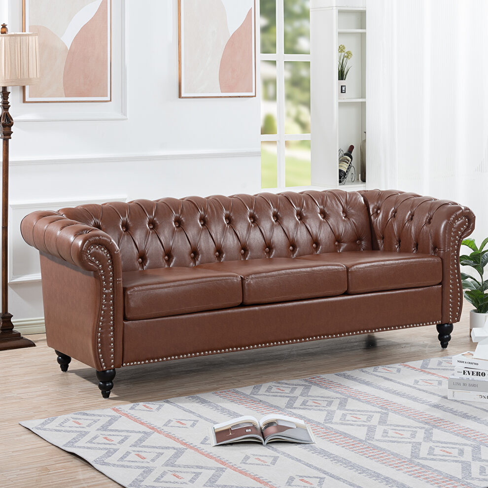 Brown pu uphostery rolled arm chesterfield three seater sofa by La Spezia