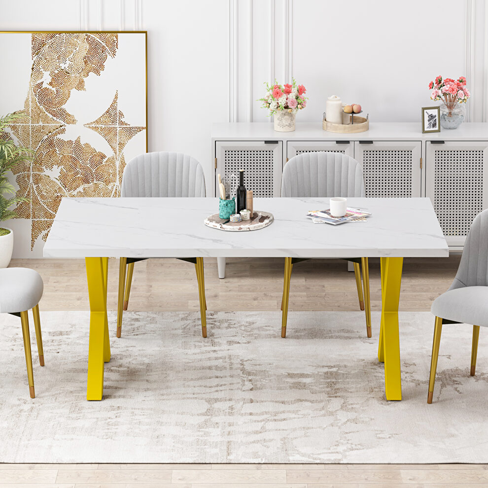 Modern square dining table with printed white marble top and gold x-shape legs by La Spezia
