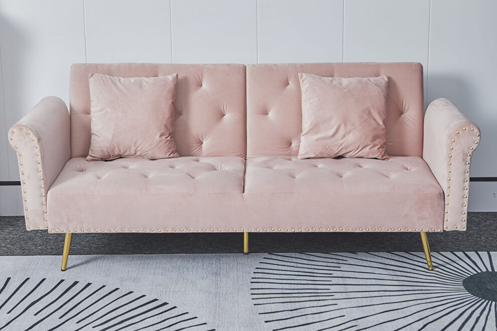 Pink velvet nailhead sofa bed with throw pillow and midfoot by La Spezia