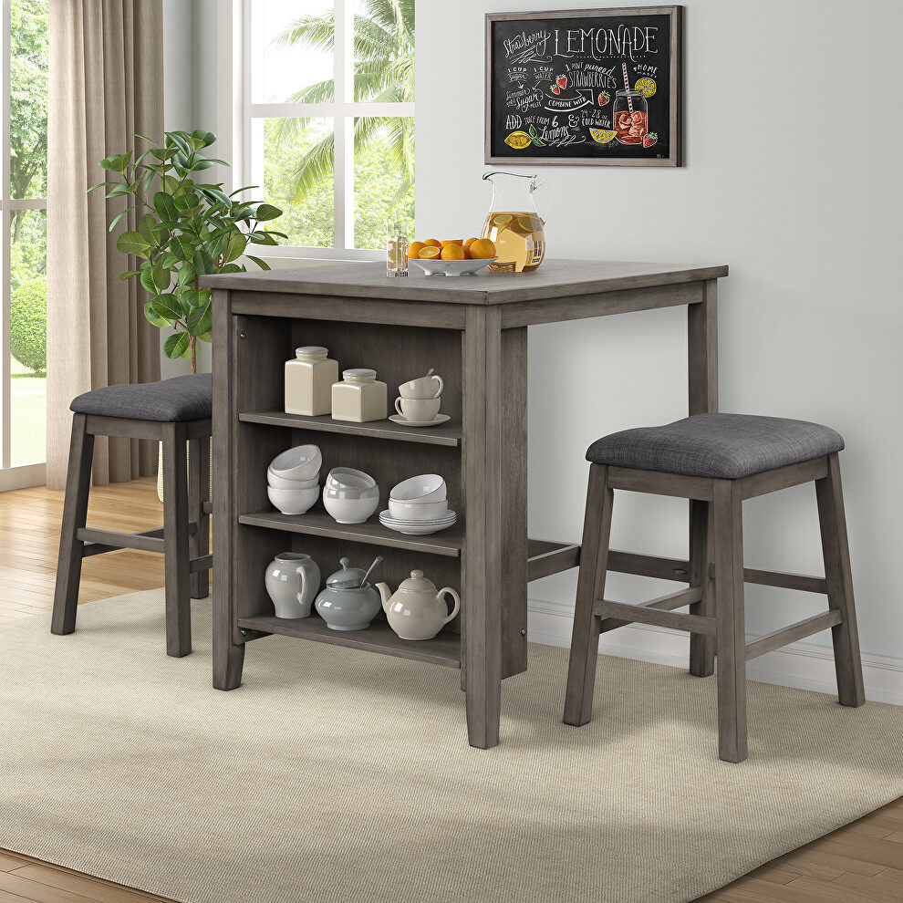 Dark gray 3 piece square dining table with padded stools by La Spezia