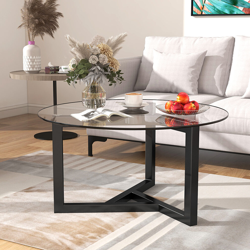 Tempered glass top and black wood base round coffee table by La Spezia