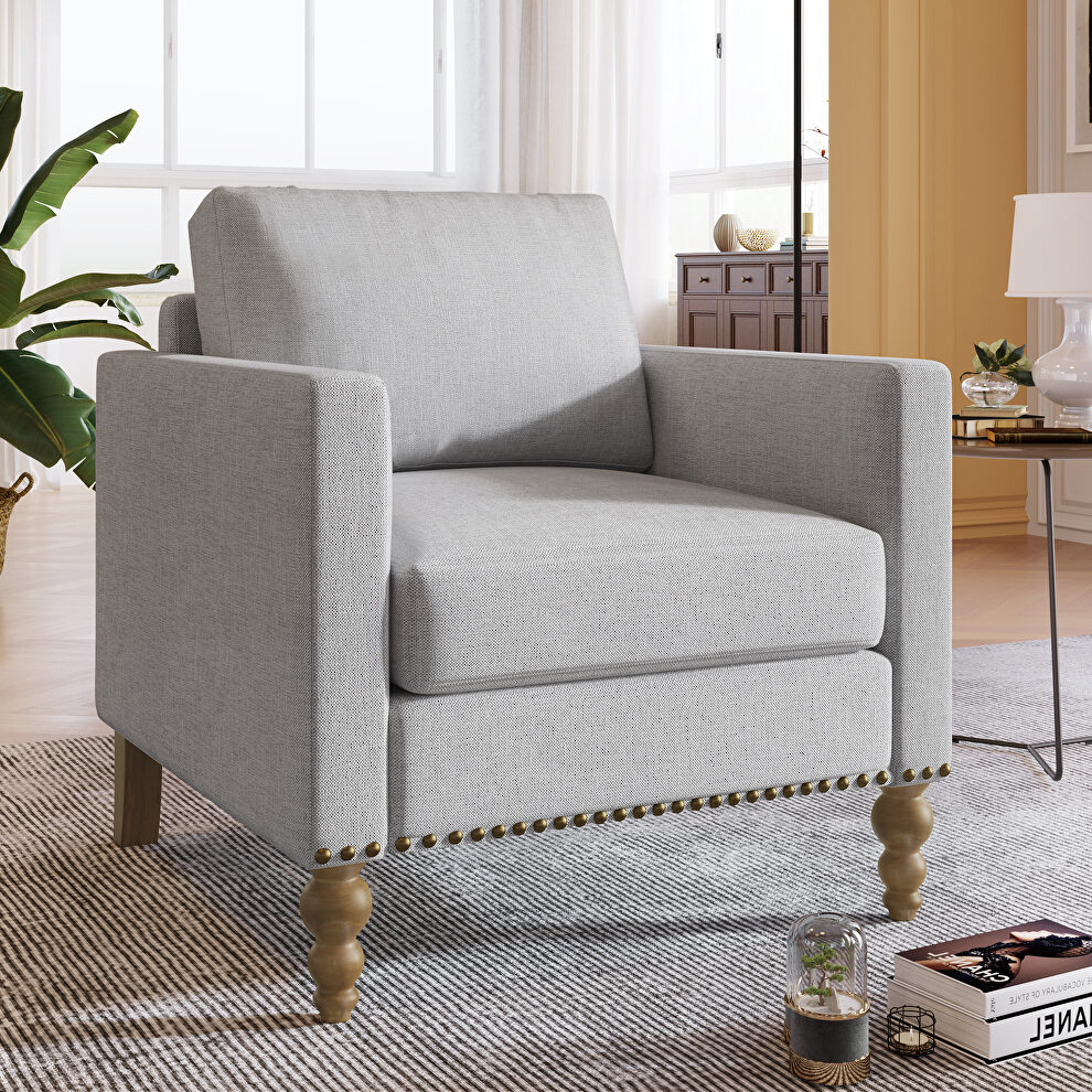 Light gray classic linen accent chair with bronze nailhead trim by La Spezia