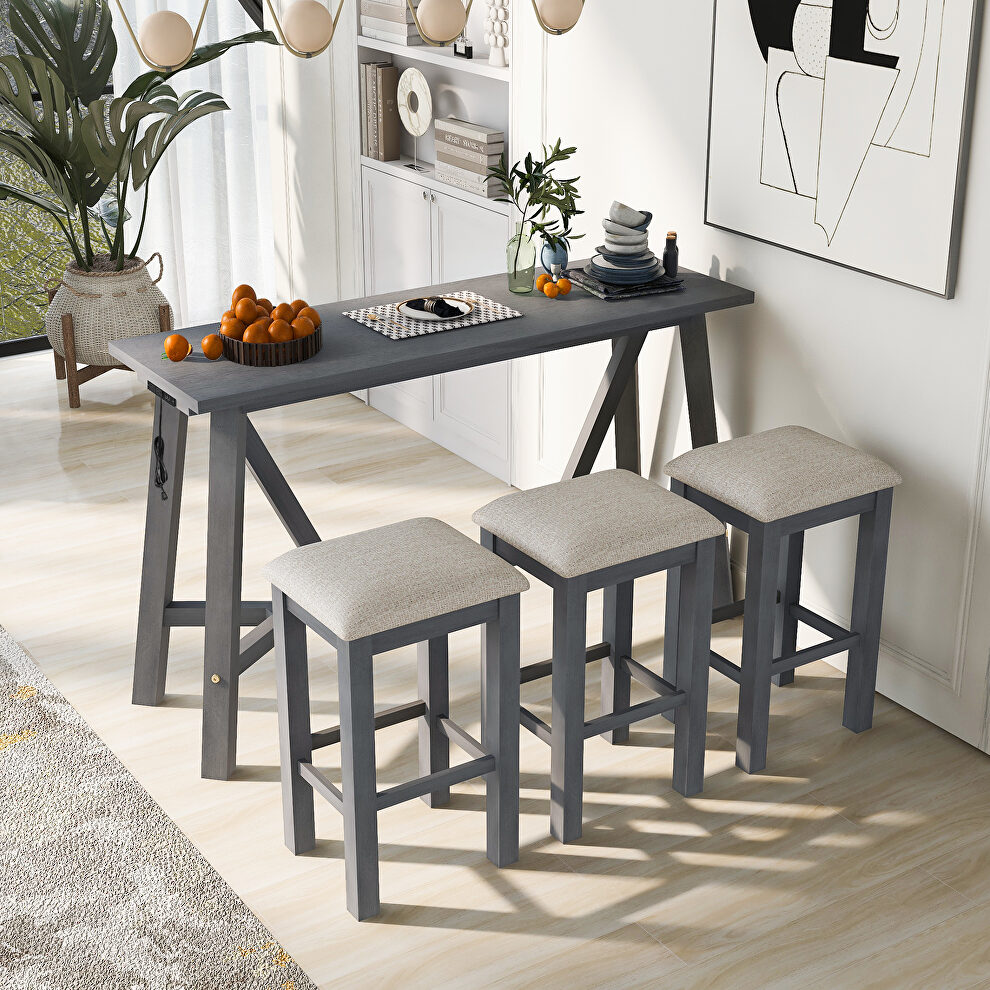 Gray dining bar table set with 3 upholstered stools in cream by La Spezia