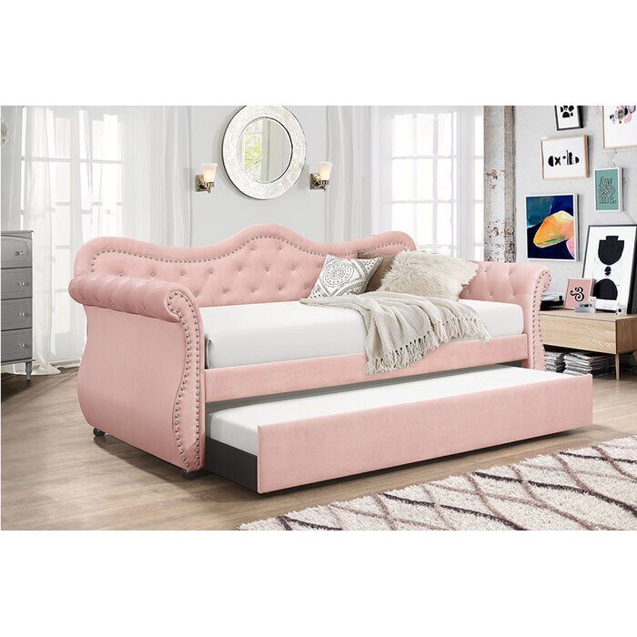 Upholstered velvet wood daybed with trundle in pink by La Spezia