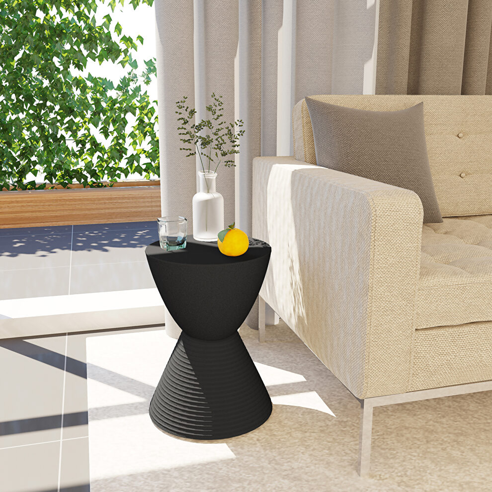 Black smooth top over a ribbed design bottom side table by Leisure Mod