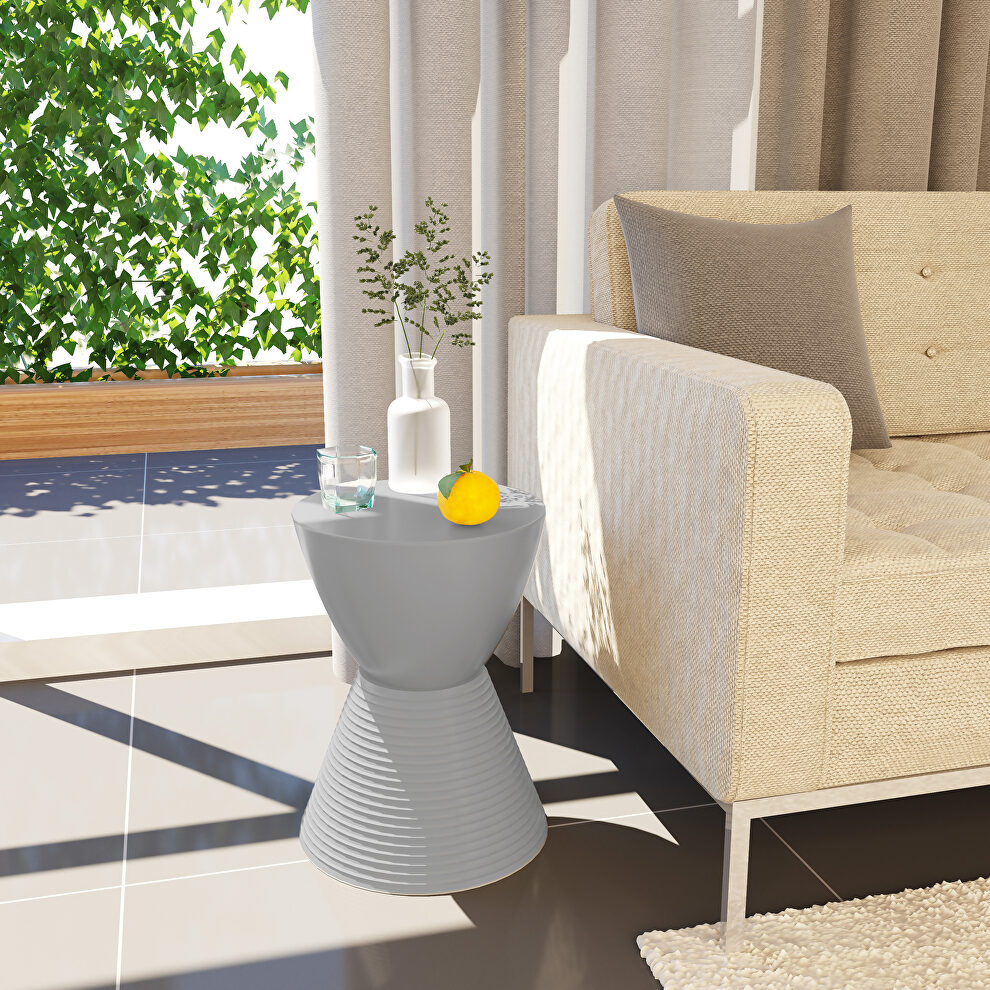 Light gray smooth top over a ribbed design bottom side table by Leisure Mod