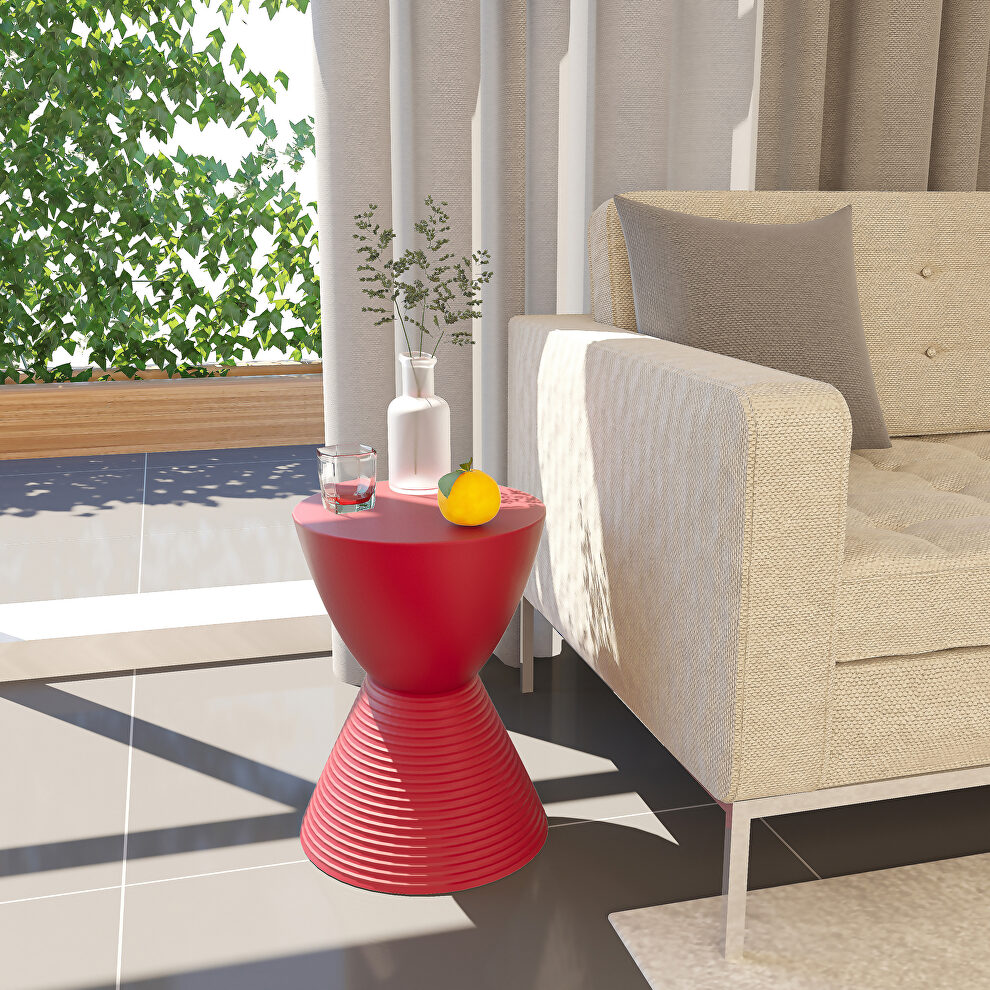 Red smooth top over a ribbed design bottom side table by Leisure Mod