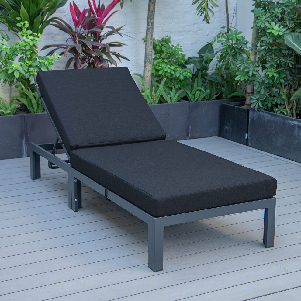 Modern outdoor chaise lounge chair with black cushions by Leisure Mod