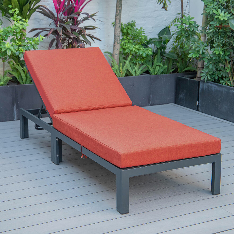 Modern outdoor chaise lounge chair with orange cushions by Leisure Mod