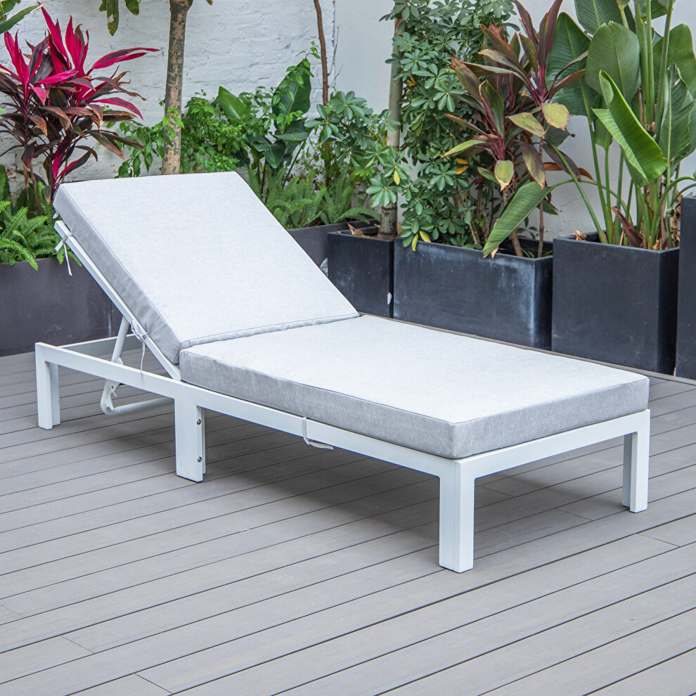 Modern outdoor white chaise lounge chair with light gray cushions by Leisure Mod