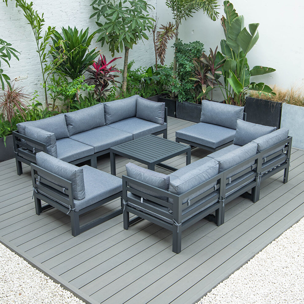 9-piece patio sectional with coffee table black aluminum with blue cushions by Leisure Mod
