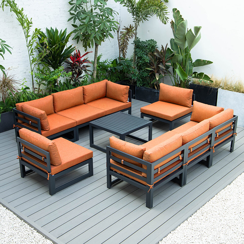 9-piece patio sectional with coffee table black aluminum with orange cushions by Leisure Mod
