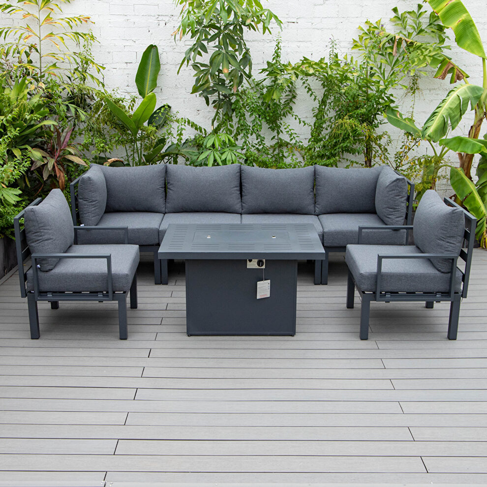 Black cushions 7-piece patio sectional and fire pit table black aluminum by Leisure Mod