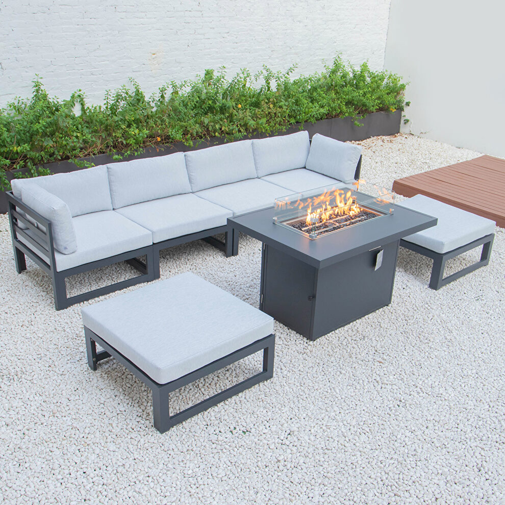 Light gray cushions 7-piece patio ottoman sectional and fire pit table black aluminum by Leisure Mod