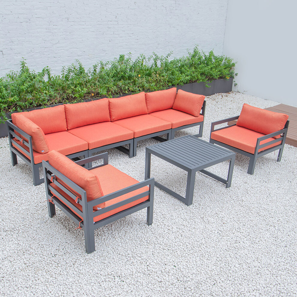 Orange cushions 7-piece patio sectional & coffee table set black aluminum by Leisure Mod