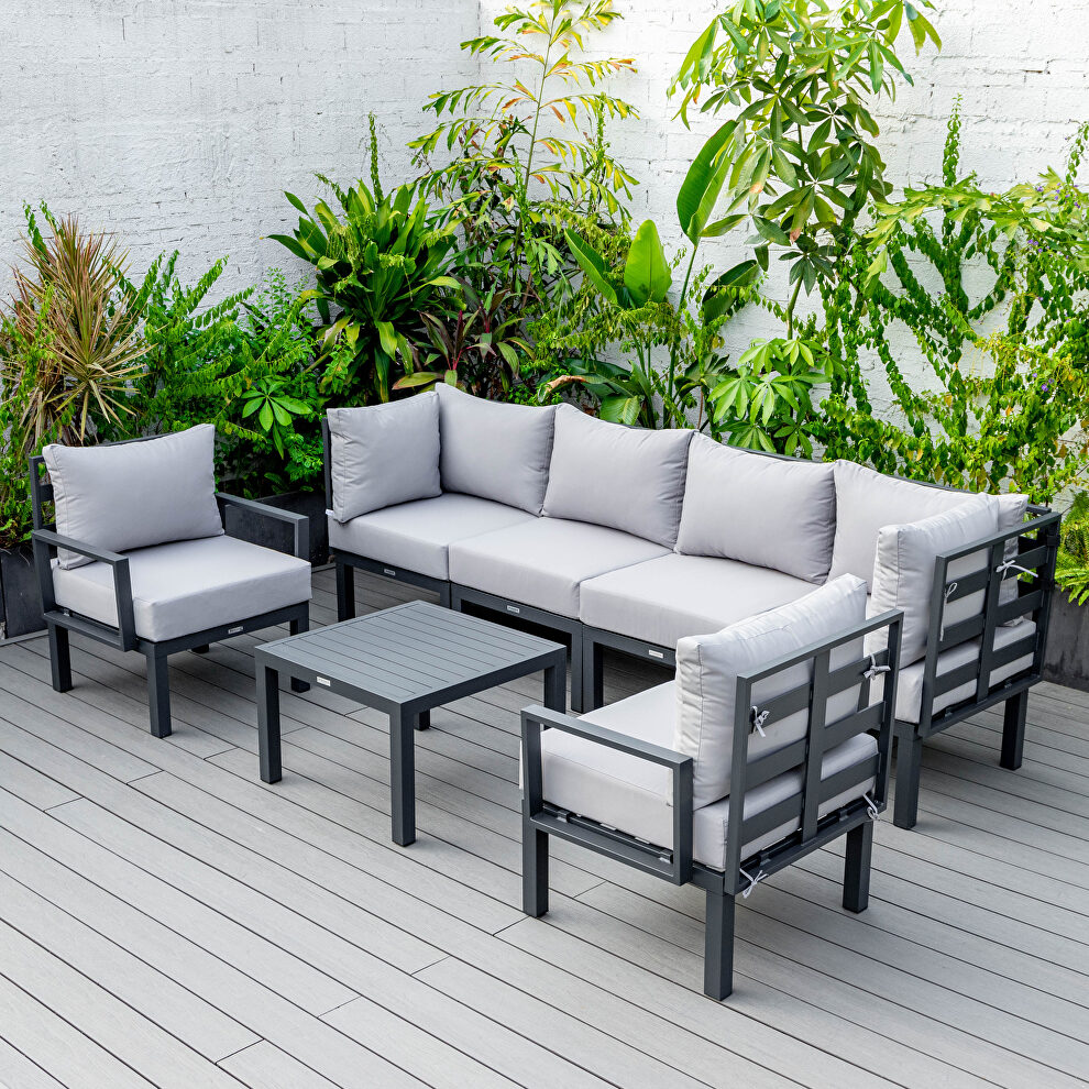 Light gray finish cushions 7-piece patio sectional and coffee table set black aluminum by Leisure Mod