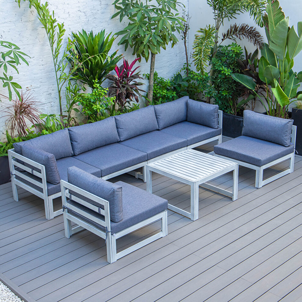 Blue finish cushions 7-piece patio sectional and coffee table set in weathered gray aluminum by Leisure Mod
