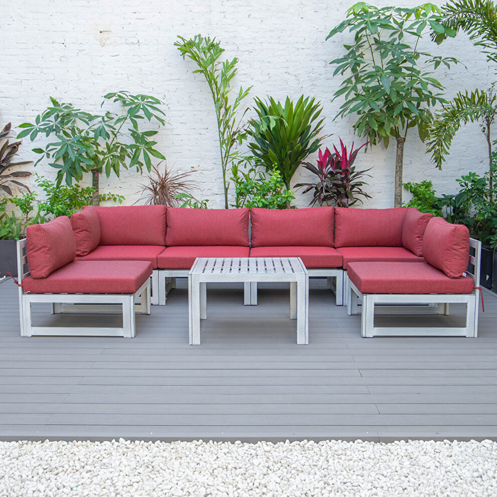 Red finish cushions 7-piece patio sectional and coffee table set in weathered gray aluminum by Leisure Mod