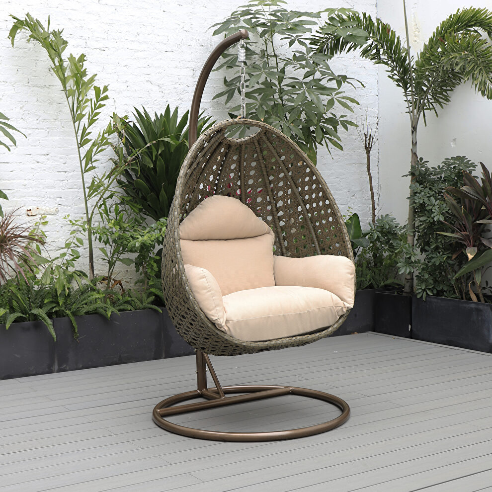 Beige cushion wicker hanging egg swing chair by Leisure Mod