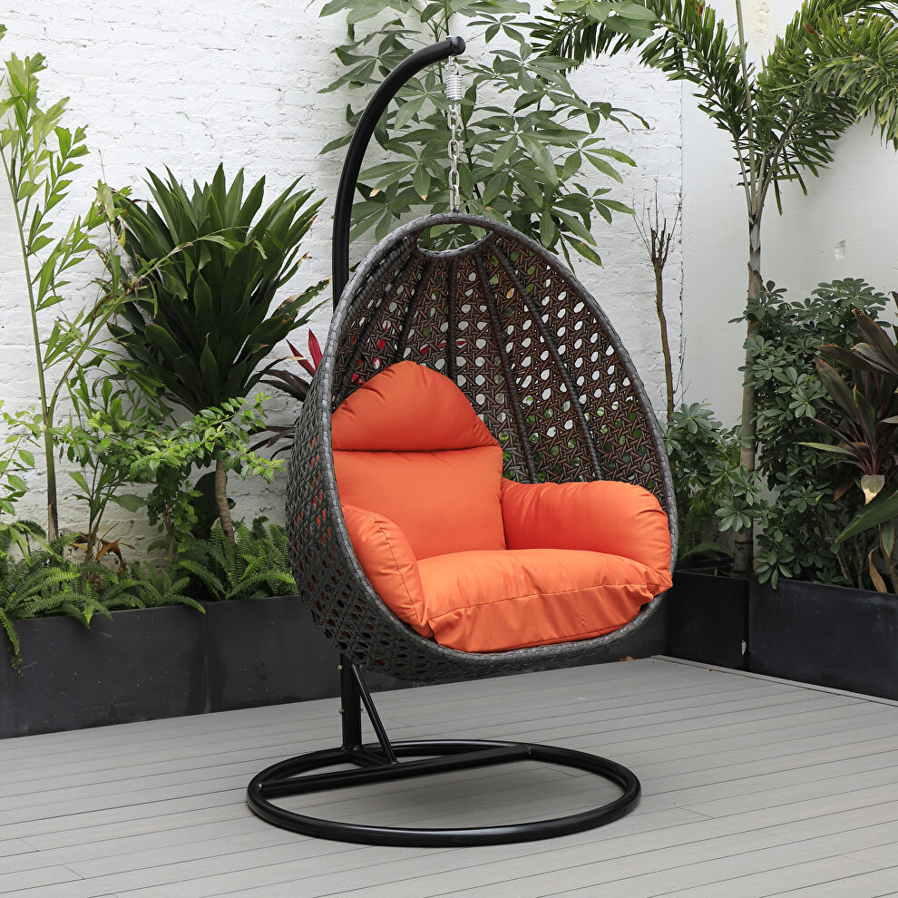 Orange cushion and charcoal wicker hanging egg swing chair by Leisure Mod