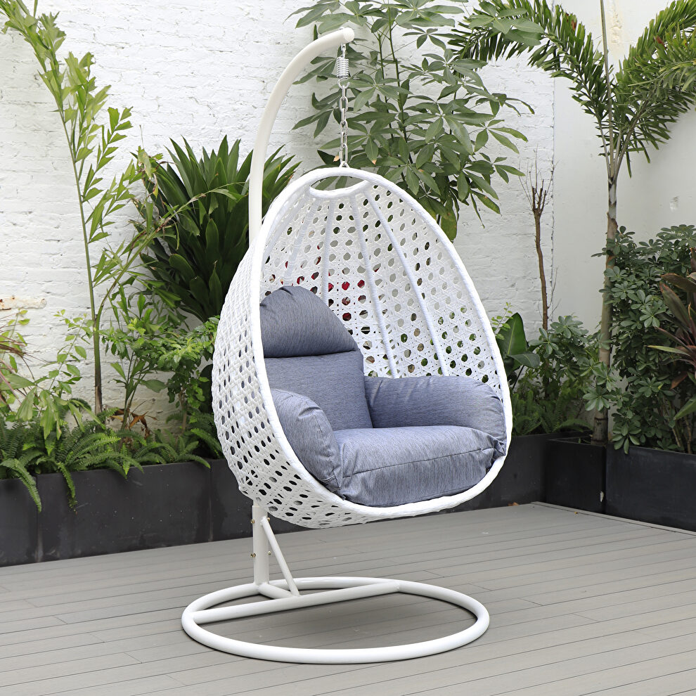 Charcoal blue cushion and white wicker hanging egg swing chair by Leisure Mod