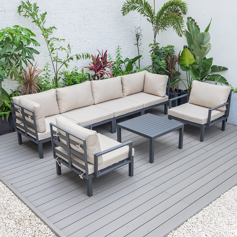 7-piece aluminum patio conversation set with coffee table and beige cushions by Leisure Mod