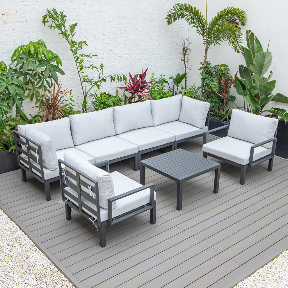 7-piece aluminum patio conversation set with coffee table and light gray cushions by Leisure Mod