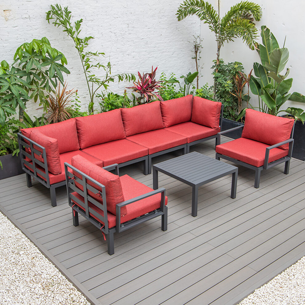 7-piece aluminum patio conversation set with coffee table and red cushions by Leisure Mod