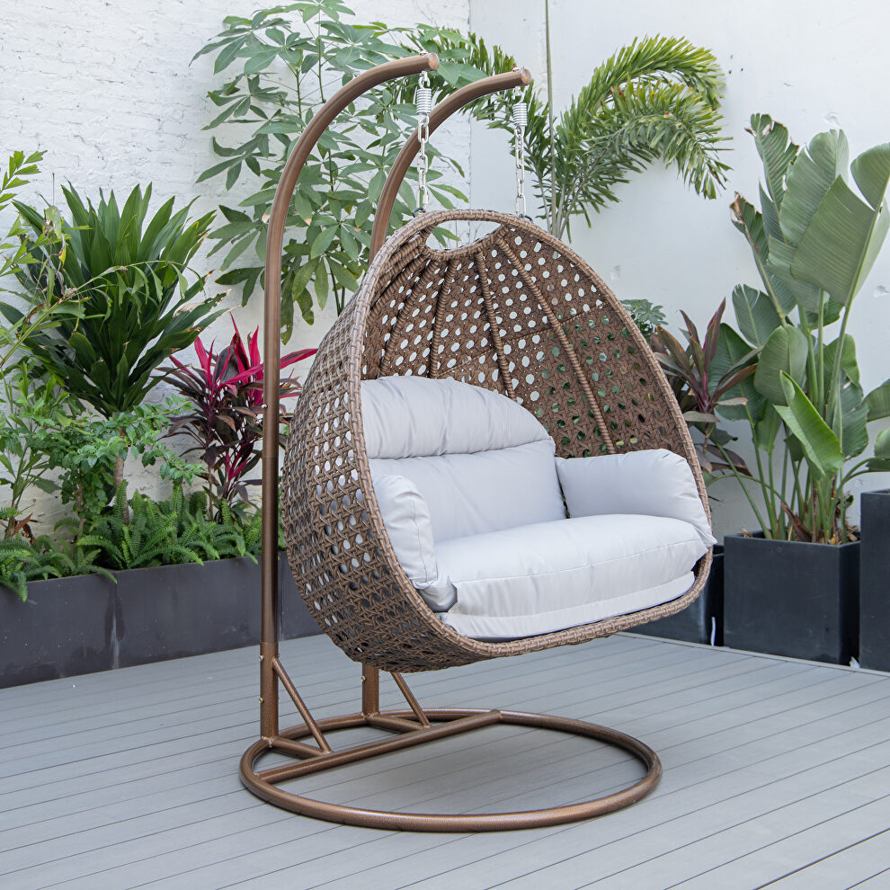 Light gray cushion and dark brown wicker hanging 2 person egg swing chair by Leisure Mod