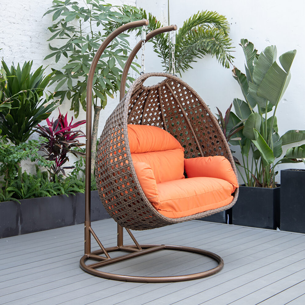Orange cushion and dark brown wicker hanging 2 person egg swing chair by Leisure Mod