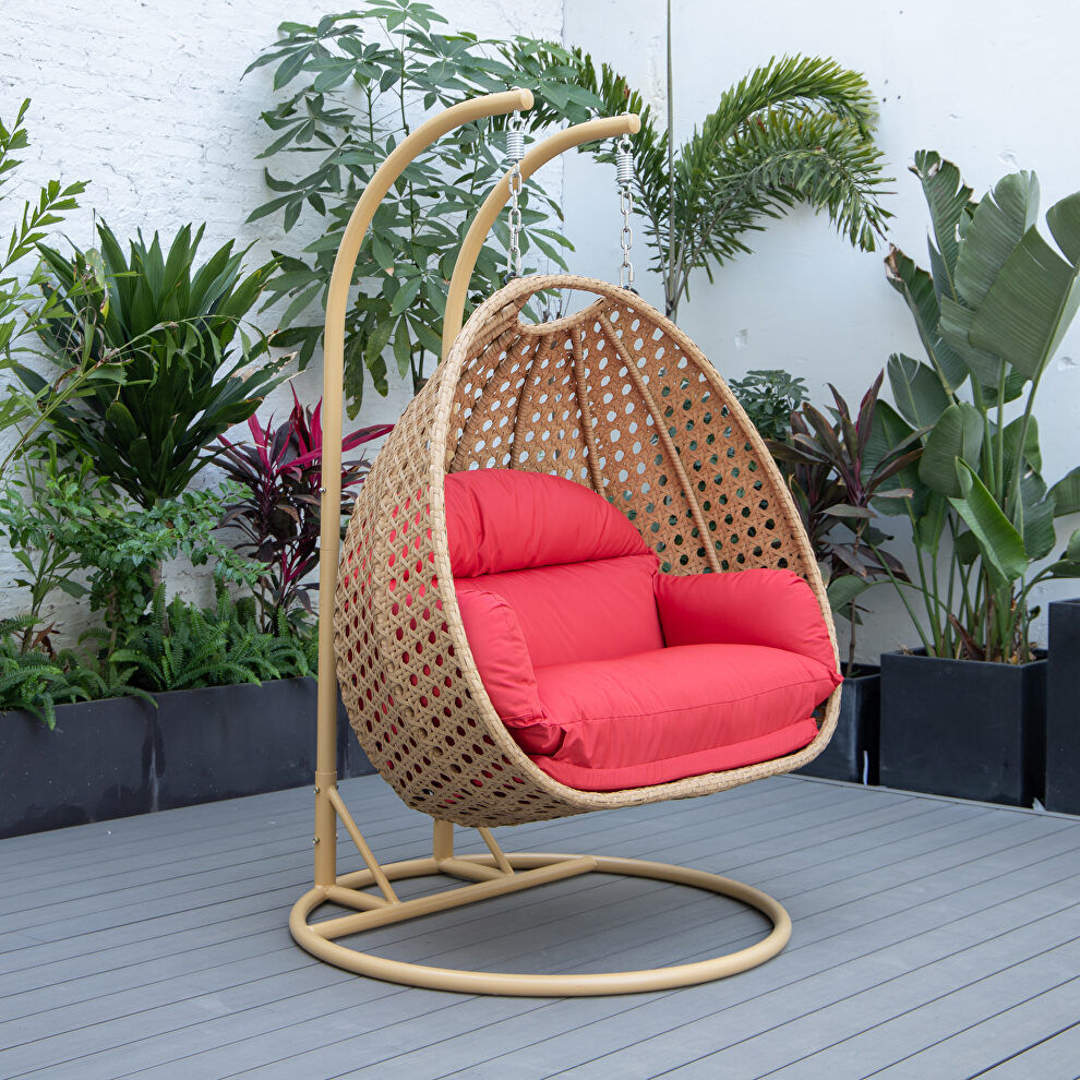 Red cushion and light brown wicker hanging 2 person egg swing chair by Leisure Mod