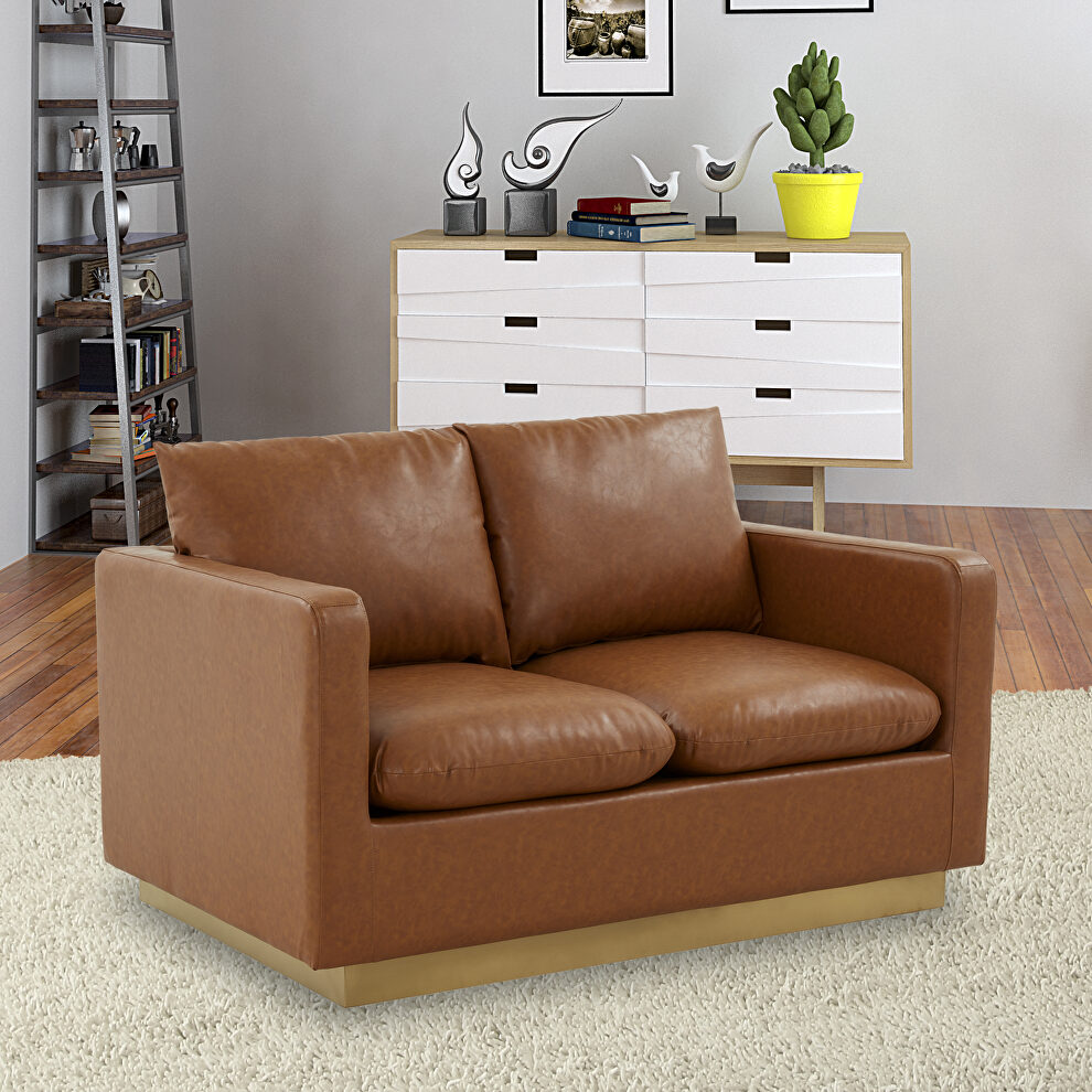 Modern style upholstered cognac tan leather loveseat with gold frame by Leisure Mod
