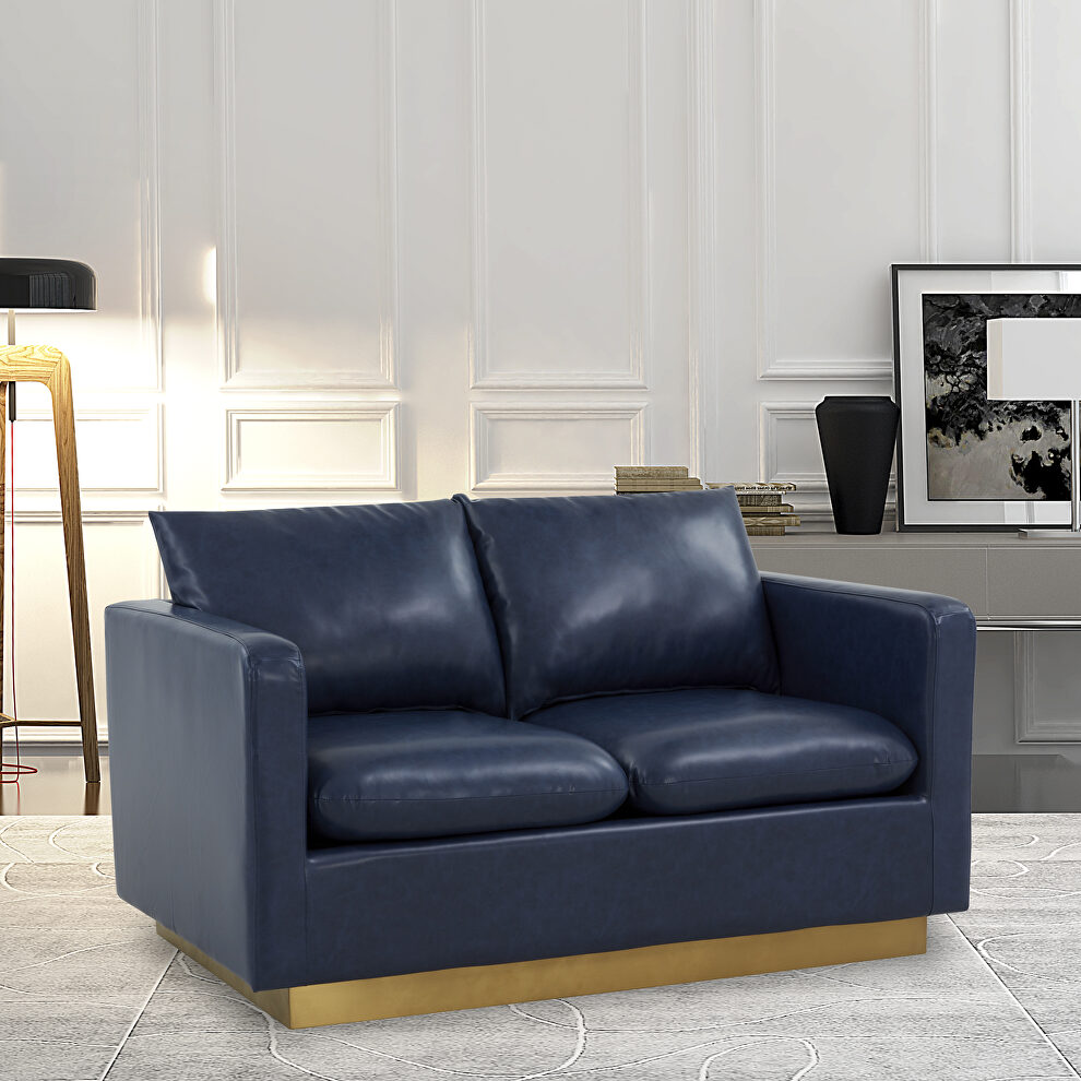 Modern style upholstered navy blue leather loveseat with gold frame by Leisure Mod