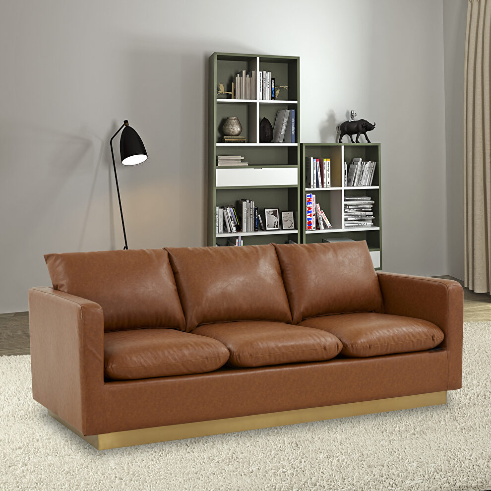 Modern style upholstered cognac tan leather sofa with gold frame by Leisure Mod