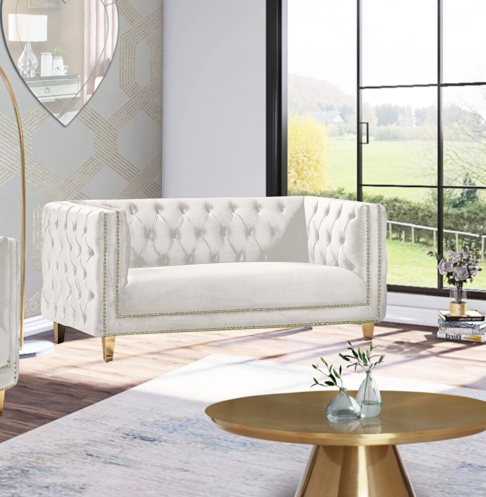 Cream velvet / gold nailheads stylish loveseat by Meridian