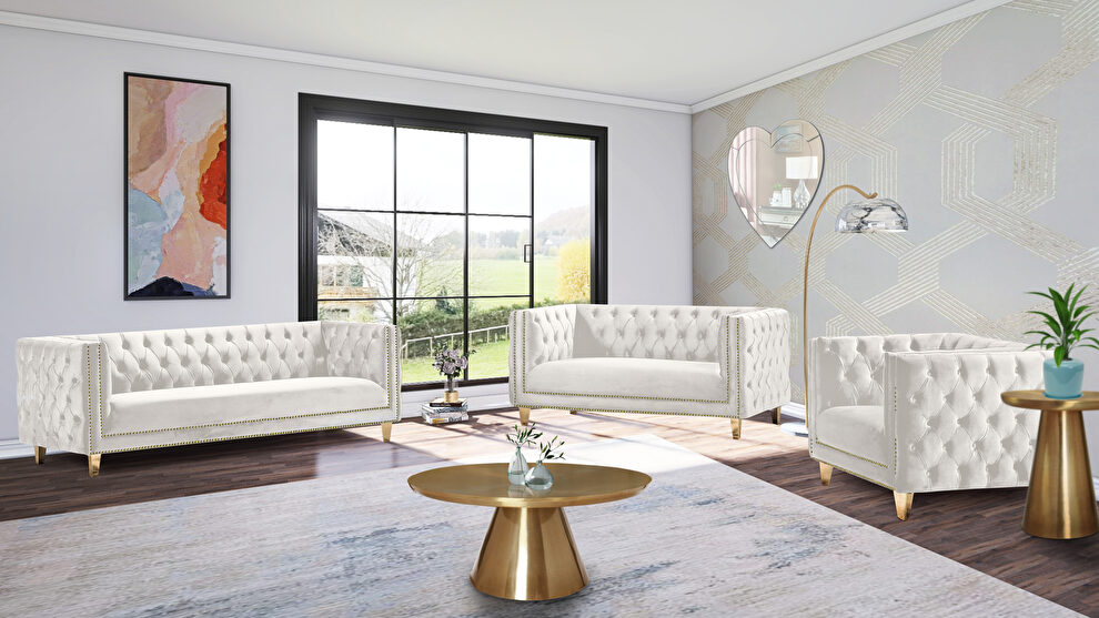 Cream velvet / gold nailheads stylish sofa by Meridian