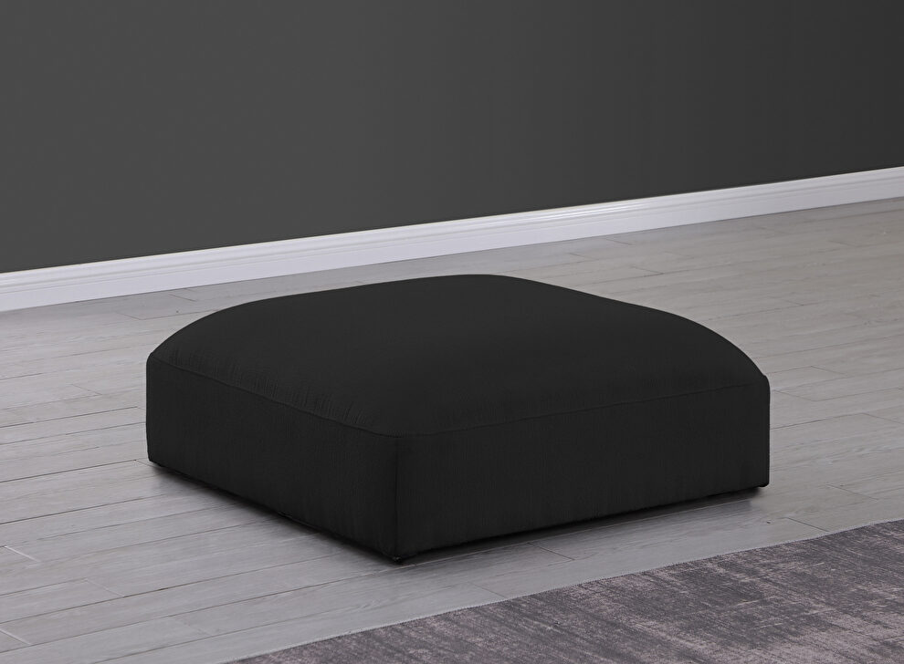 Modular low-profile black velvet ottoman by Meridian