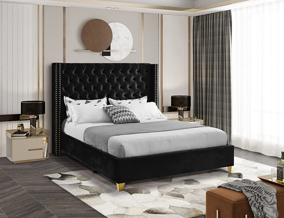 Modern gold legs / nailheads black velvet bed by Meridian
