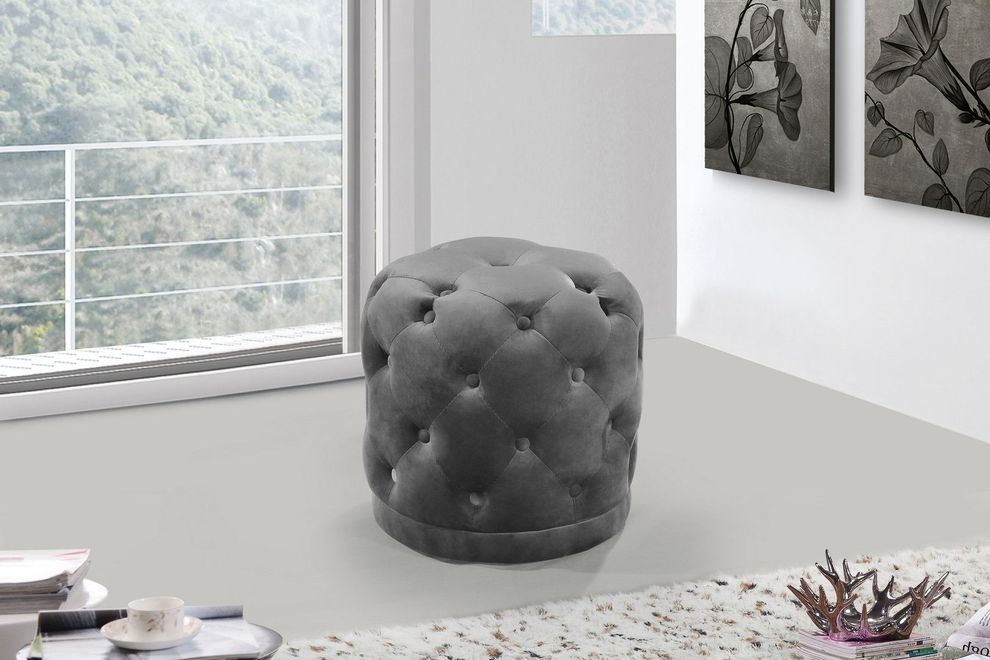 Gray velvet tufted round ottoman by Meridian